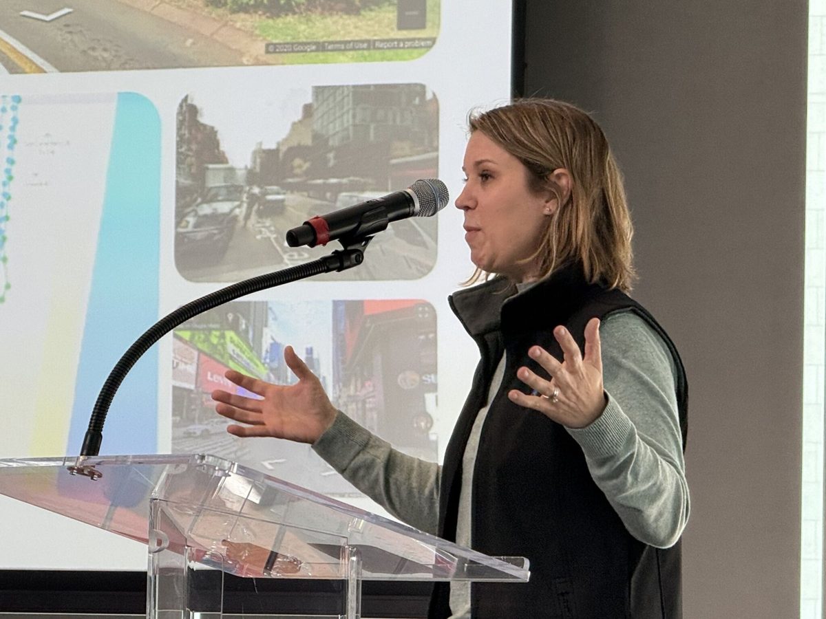 Melody Olson speaking at the podium at WGIC Horizons